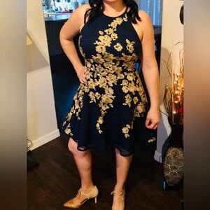 Beautiful navy blue dress with gold details. Size 14.